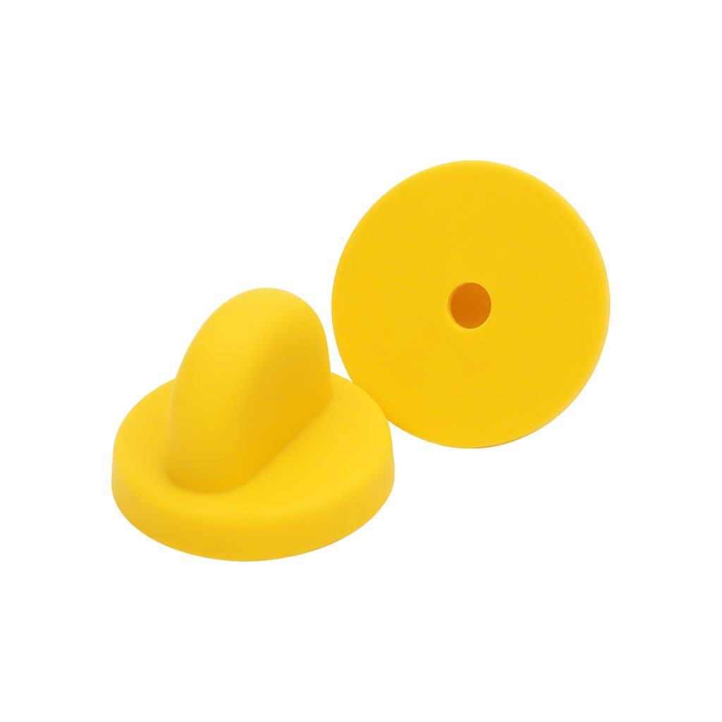 Losse rubber sluiting voor een pin in de kleur geel.